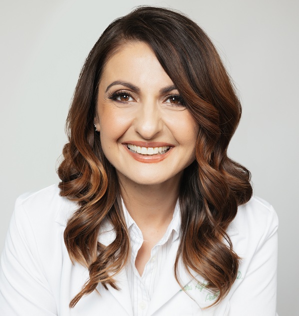 Headshot of Sara Aghamohammadi, wearing a white coat.