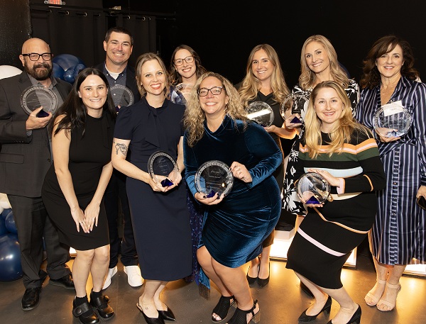 Public Affairs & Marketing team members celebrate with PRSA Influence Awards.
