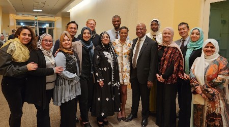 Members of the Muslim Faculty and Staff employee resource group posing for a group photo