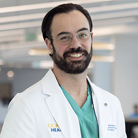 Surgeon wearing a white coat at a medical office building