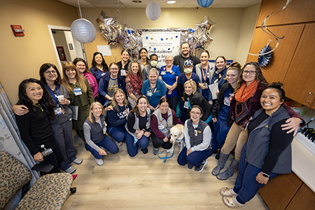 Large group standing in a break room 
