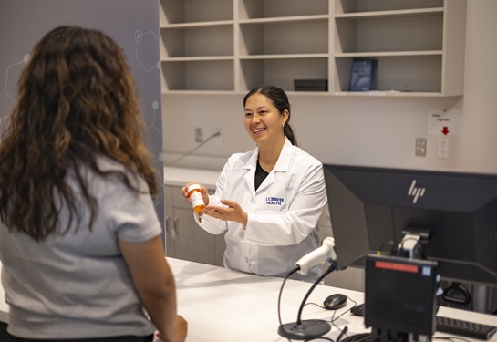 Specialty Pharmacy team member helps a patient