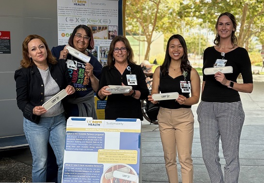 team members gather at utensil distribution