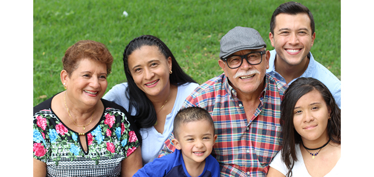 Hispanic family of six: grandparents, parents, a girl, and a little boy