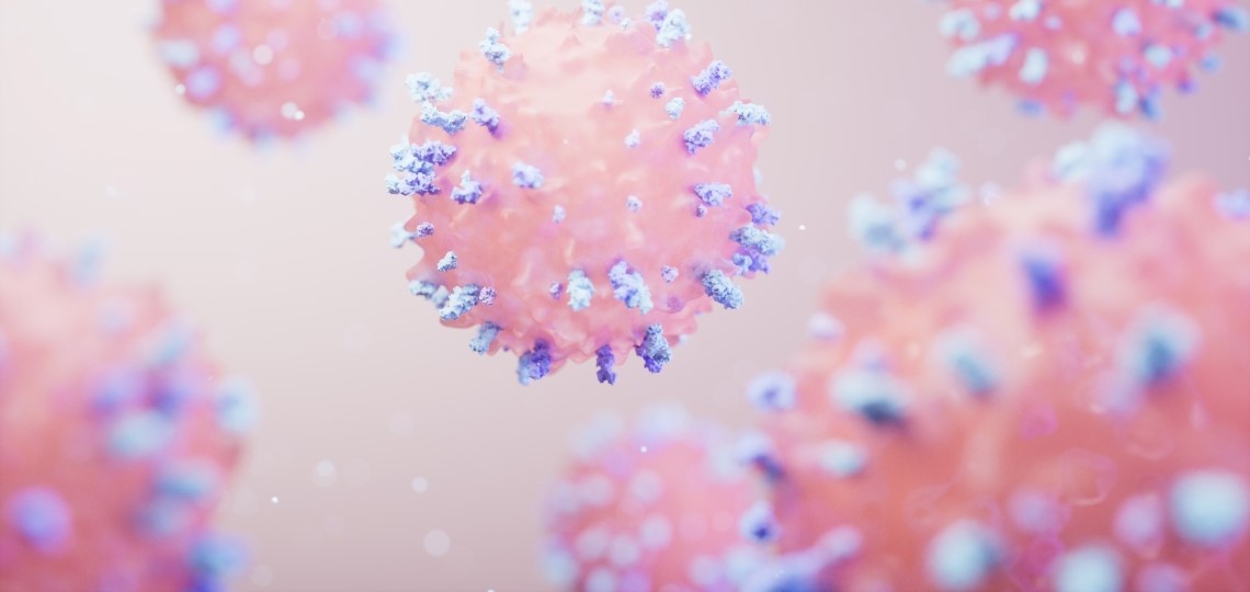 A 3D illustration of pink immune cells with blue spikes floating against a soft, light background.