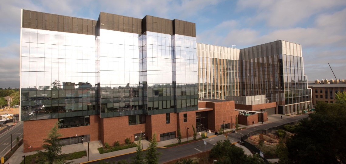 Aggie Square buildings in Sacramento featuring modern glass-and-brick research buildings and walkways.