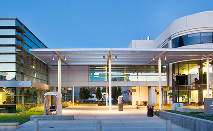 UC Davis Comprehensive Cancer Center, a metal and glass building, seen from the outside