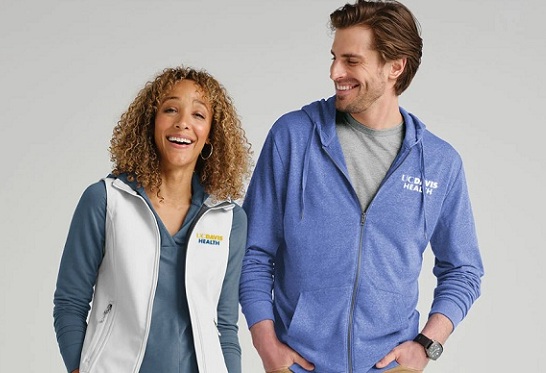 Models wearing UC Davis Health-branded outerwear available through the online Brand Shop.