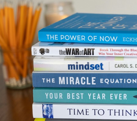Stack of books in various colors of blue