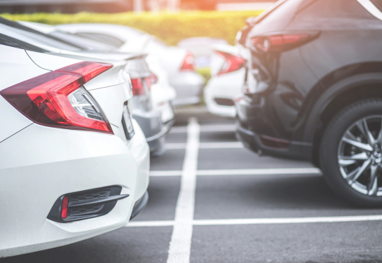 Multiple cars parked in a lot