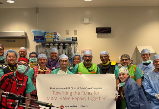Health care team poses in a hospital procedure room after the first U.S. ENHANCE EFS clinical trial case for mitral valve repair.
