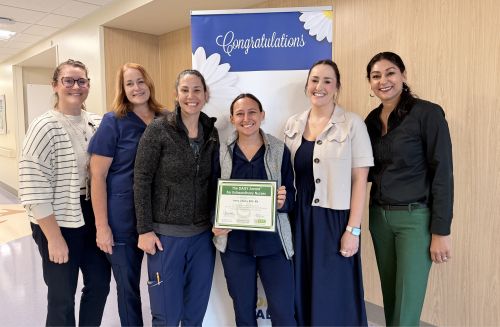 Employees celebrate Anna's DAISY Awrd