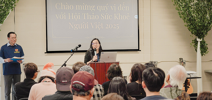 Professor Oanh Meyer is presenting for an audience from the Vietnamese community.
