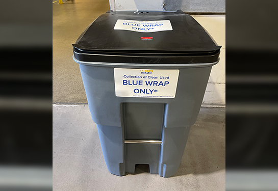 A blue wrap recycling bin within the hospital