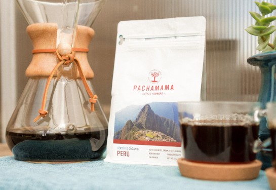 coffee carafe next to bag of pachamama coffee
