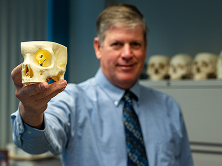 Brad Strong showing a 3-D printed skull