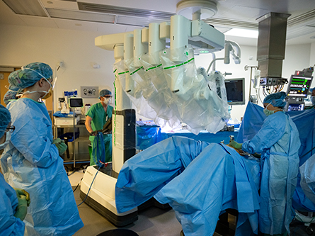 Surgery team observing a robotic surgery in progress