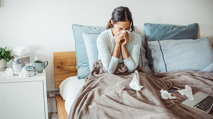 woman sick in bed