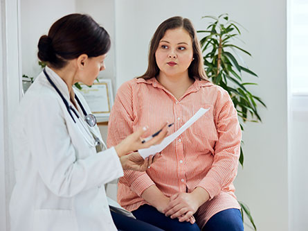 female patient talking with her doctor