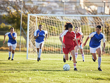 girls playing soccer, tips to prevent soccer injuries