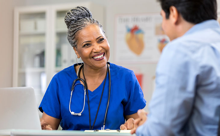 Healthcare provider talking to patient about head and neck cancers