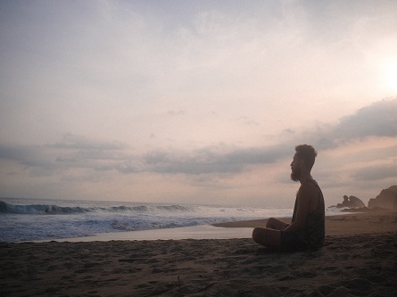 person sitting on beach