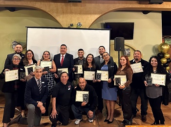 Emprende Sacramento graduates stand with their certificates of completion