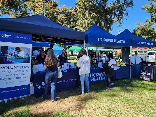 A photo of visitors at the UC Davis Health booth at Celebrate Oak Park