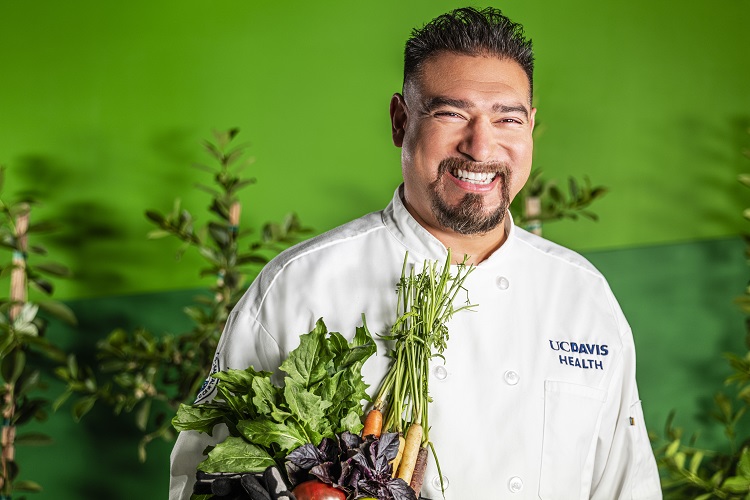 Chef Santana Diaz holding produce