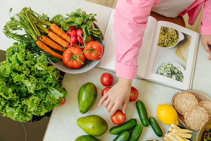 woman cooking with vegetables