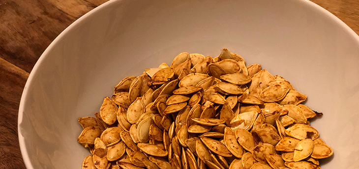 Roasted pumpkin seeds in a bowl