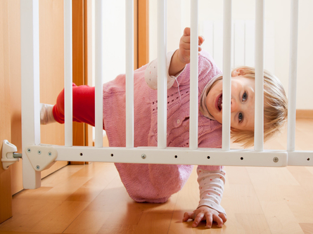 Baby looking through crib