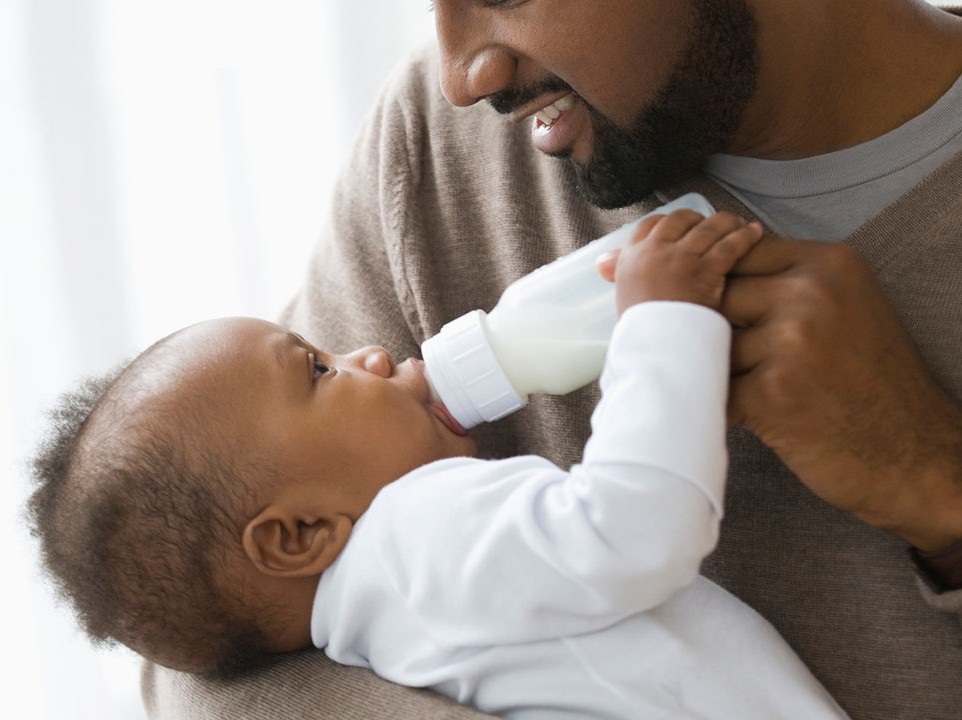 Father feeding baby 