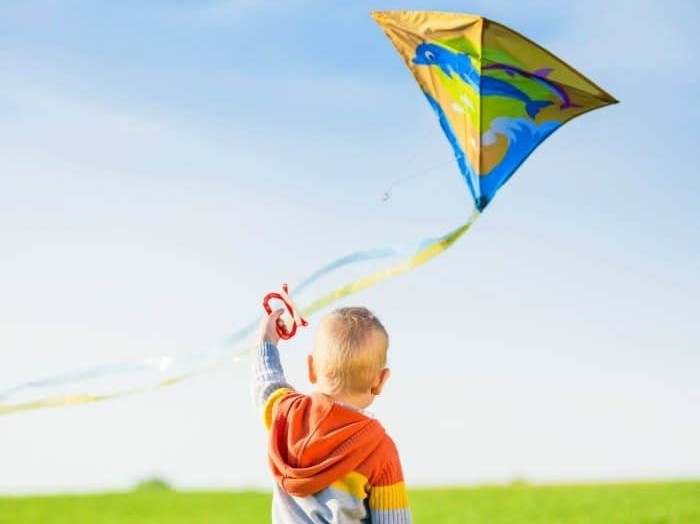 kid flying kite