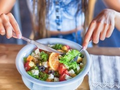 person eating salad