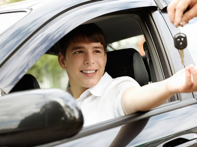 teen holding car keys