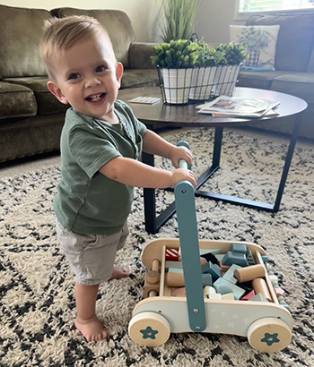 Nixon walking with his push cart.