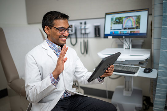 Physician talking to a patient via video visit