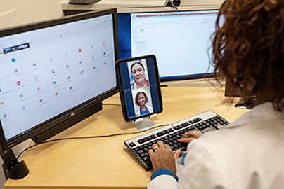 Doctors in a video conference with patient.