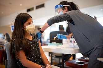 teen getting covid-19 vaccine at UC Davis Health