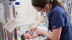 Nurse with NICU baby