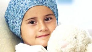 Pediatric cancer patient holding a stuffed animal
