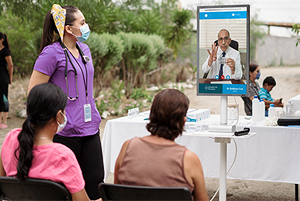 Telehealth doctor visit outdoors.