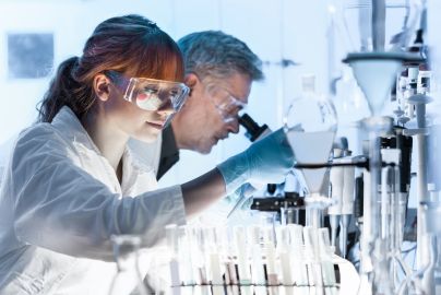two people working side by side in a research laboratory