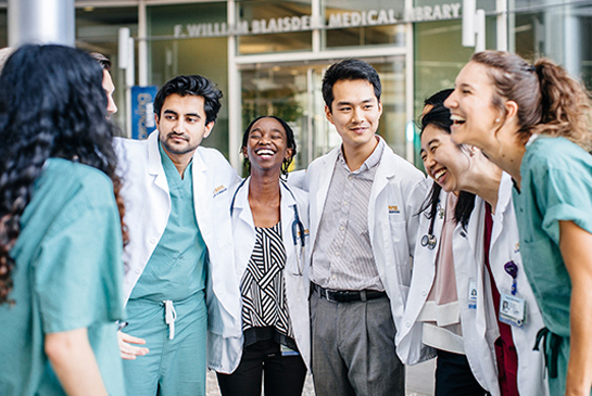 UC Davis Medical students standing outside the education building