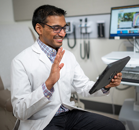 Doctor conducting a telehealth video visit using an ipad