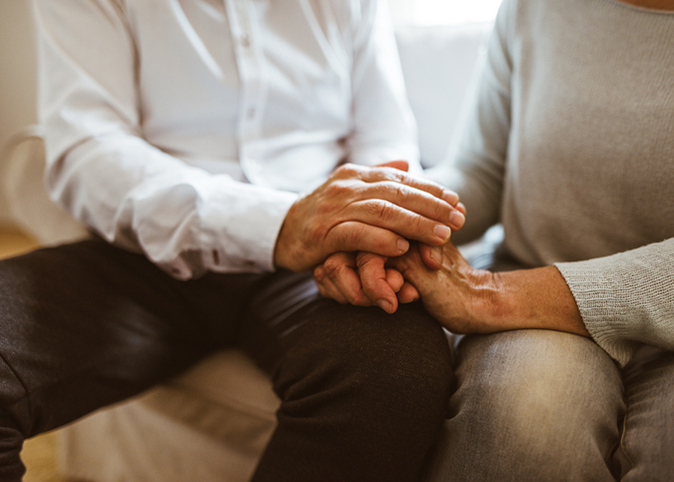 Couple holding hands