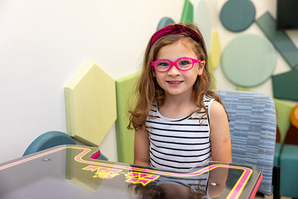 girl with red glasses