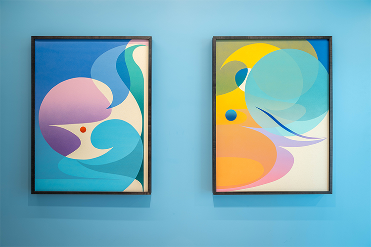 Close up of Letter to the Unknown #17 & #18 art pieces on a blue wall.