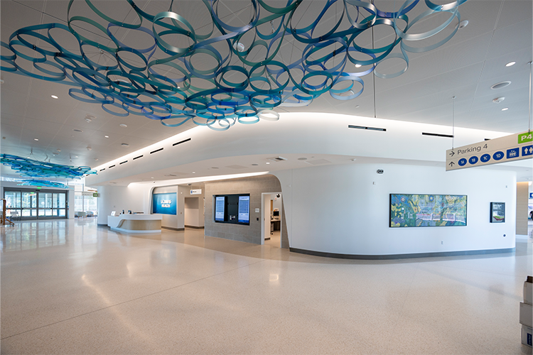 Interior first floor lobby of the 48X Complex featuring the Lifted Spirits art piece hanging from the ceiling.
